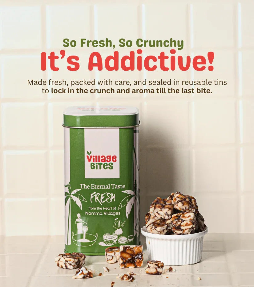 Green canister labeled 'Village Bites' with snacks on a light wooden surface.