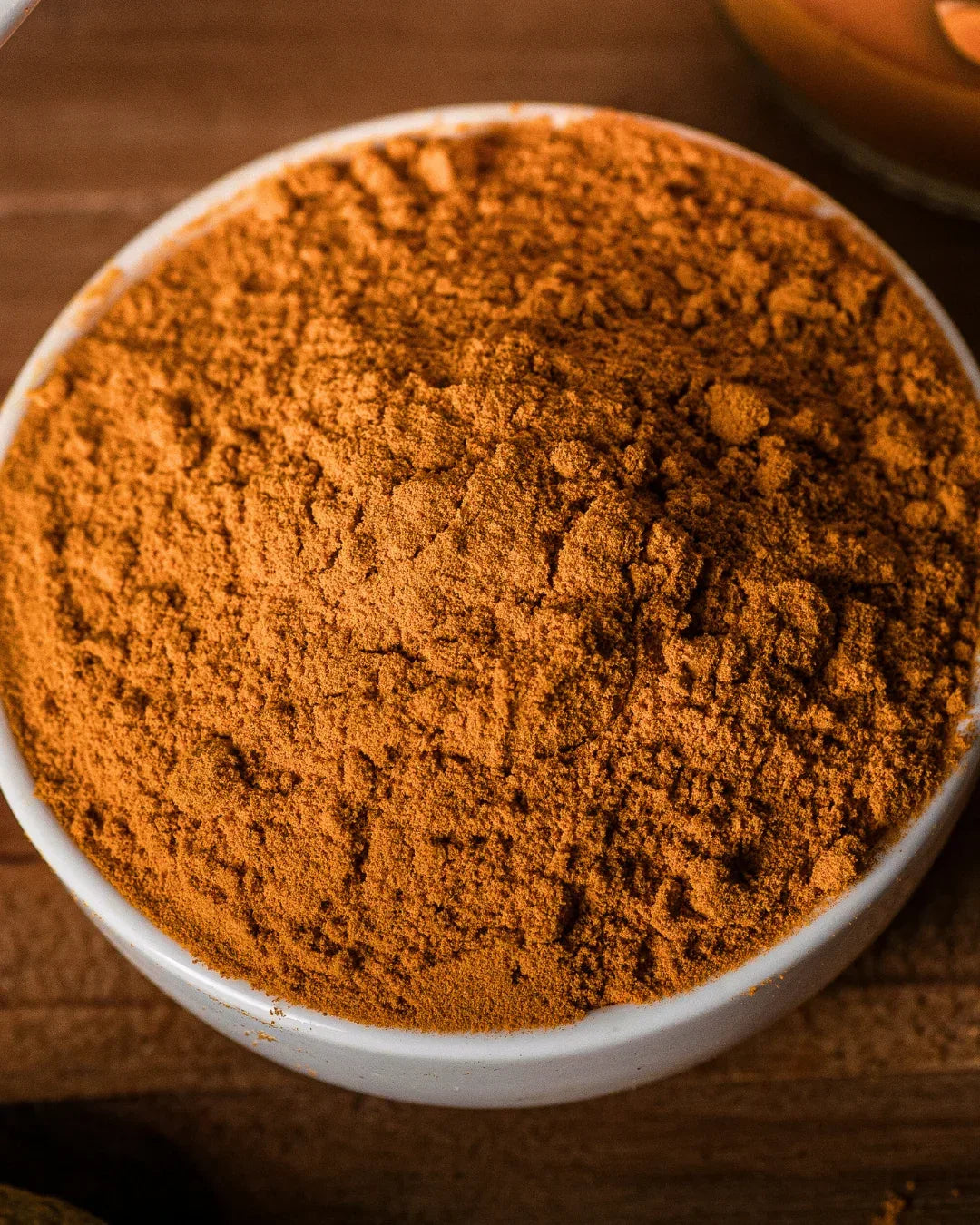 buy turmeric powder Closeup of fine powder showing rich color
