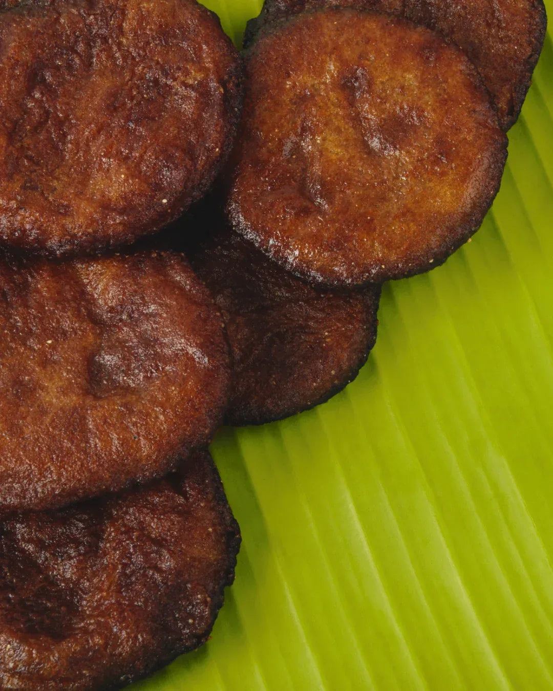 Shiny Adhirasam placed on a leaf – buy adhirasam online