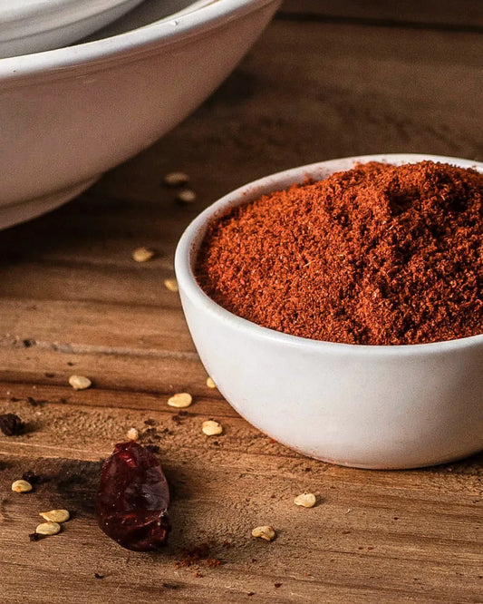 Bright red chilli powder online served in a small bowl