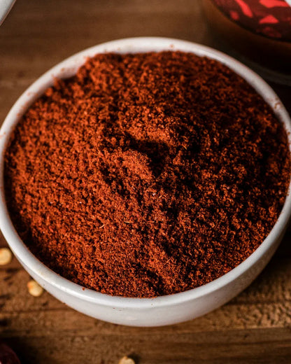 Buy chilli powder Closeup of fine, vibrant chilli powder texture