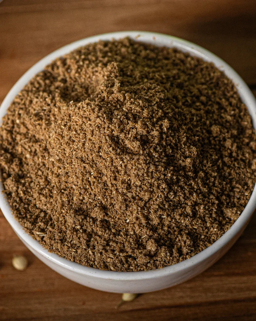 Coriander powder buy the Closeup of fine coriander powder texture