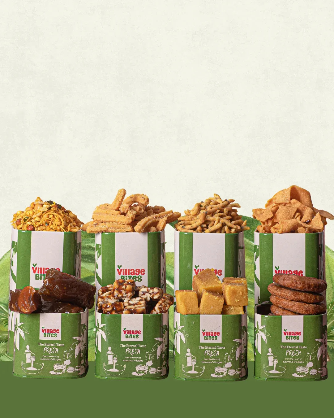 8-in-1 Sweet & Savoury Treat Pack on green leaf background featuring halwa, Mysore Pak, chikki, adhirasam, pepper sev, butter murukku, mixtures, and seeval tins