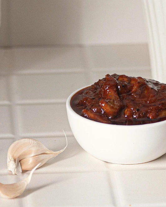 South Indian garlic pickle served online in ceramic bowl