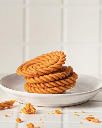 Buy murukku online - displayed beside The Village Bites snack box